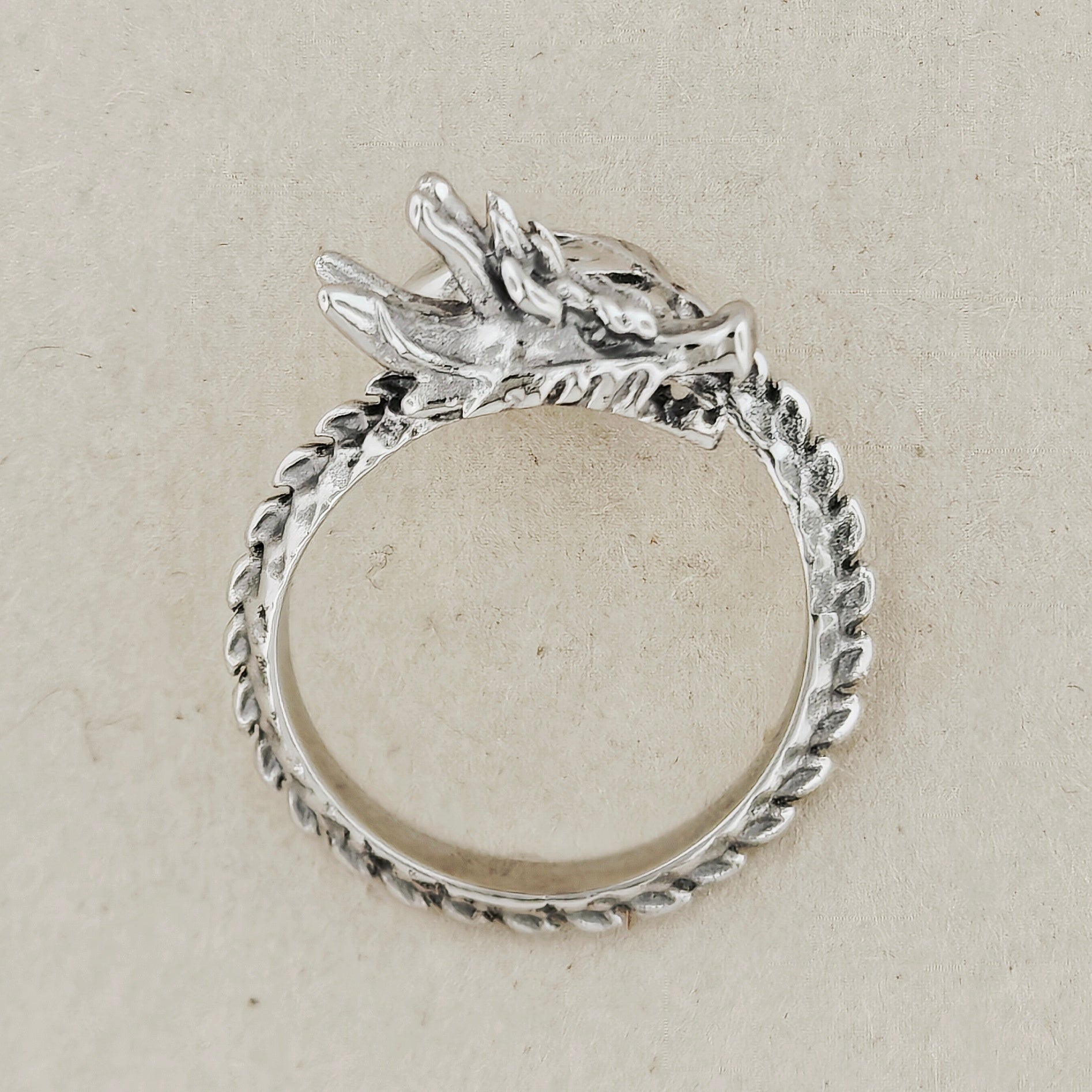 Adjustable Asian Dragon Ring with detailed scales and whiskers in sterling silver, antique bronze, or stainless steel. Handmade fantasy jewellery by Le Dragon Argenté