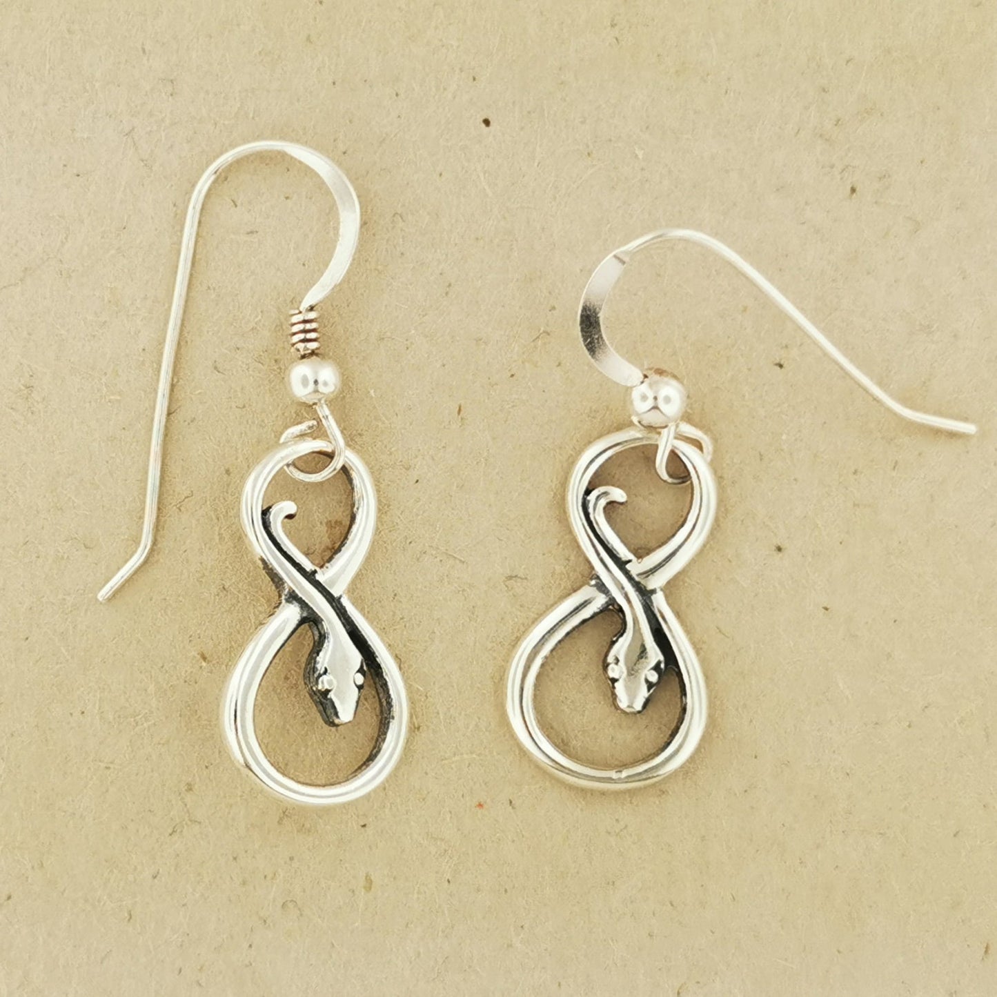 Coiled Snake Charm Earrings in Sterling Silver – Handmade Serpent Jewellery by Le Dragon Argenté