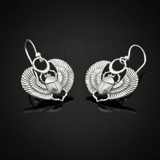 Handmade Winged scarab beetle earrings inspired by ancient Egyptian jewellery, available in sterling silver, antique bronze, or stainless steel. These symbolic scarab talisman earrings represent protection, rebirth, and transformation. A meaningful accessory for mythology lovers, museum enthusiasts, and those who enjoy unique handcrafted historical-style jewellery.