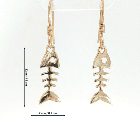 Fishbone charm earrings in antique bronze, quirky ocean jewelry, small fish skeleton dangle earrings, nautical themed animal jewelry, minimalist beach inspired earrings with playful aesthetic by Le Dragon Argenté