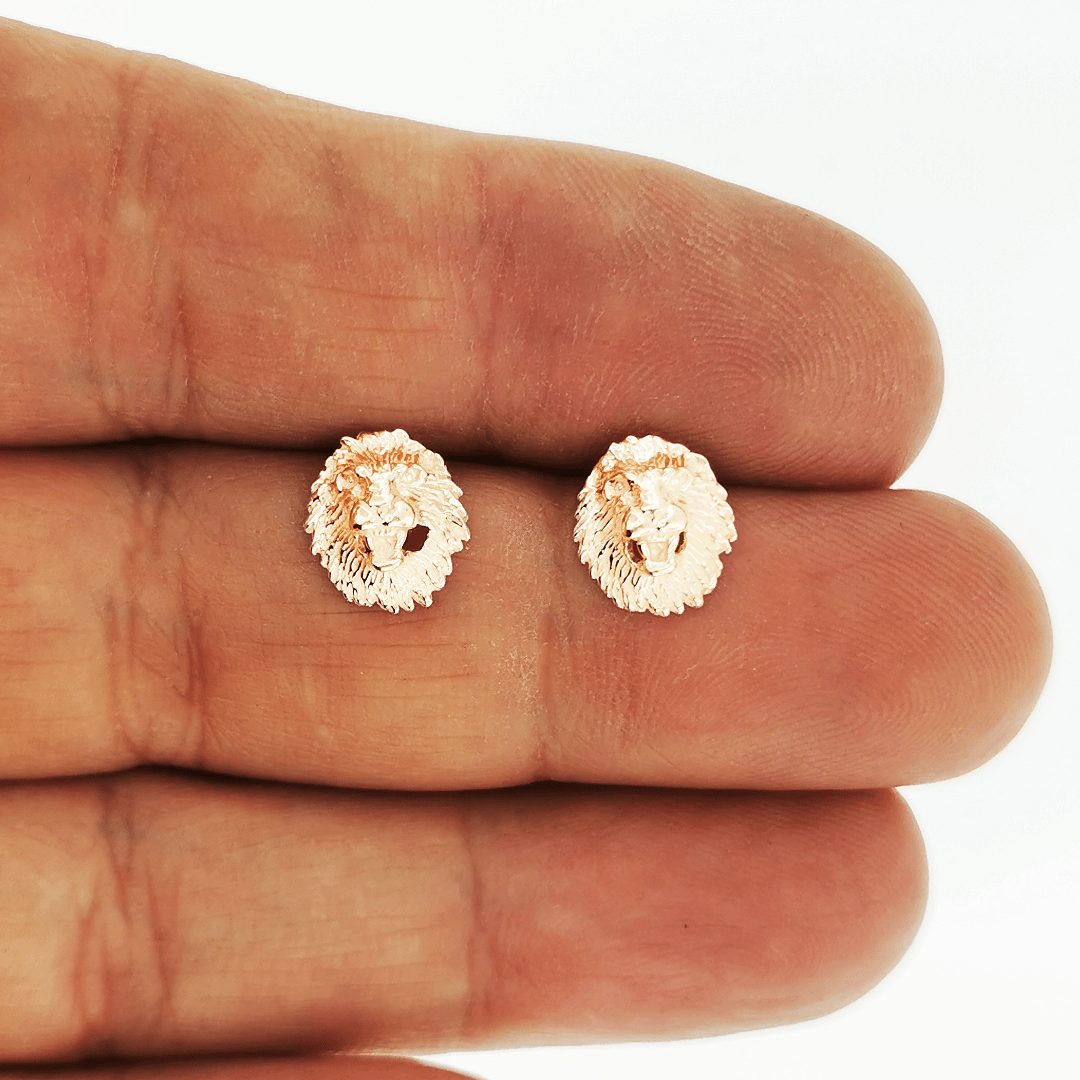 Made-to-order lion head studs by Le Dragon Argenté in solid gold, available in white, pink, or yellow gold and 10k, 14k, or 18k options.