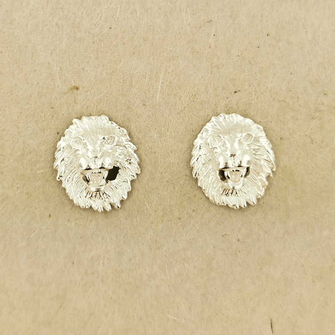 Made-to-order lion head studs by Le Dragon Argenté in solid gold, available in white, pink, or yellow gold and 10k, 14k, or 18k options.