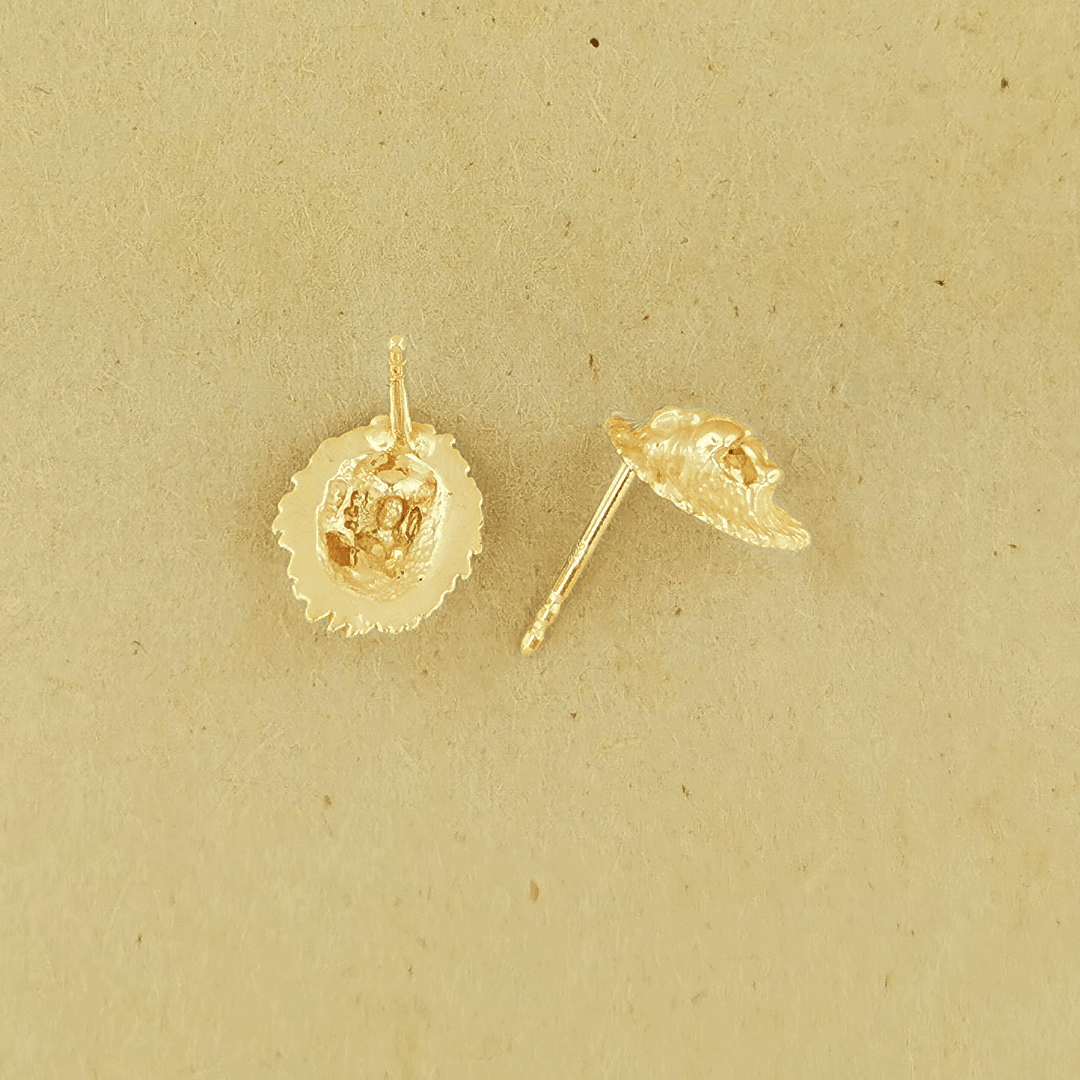 Made-to-order lion head studs by Le Dragon Argenté in solid gold, available in white, pink, or yellow gold and 10k, 14k, or 18k options.