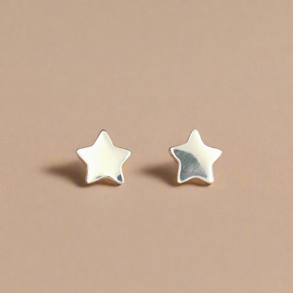Handmade star-shaped stud earrings in sterling silver, celestial jewellery by Le Dragon Argenté