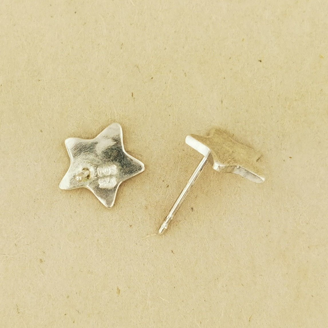 Handmade star-shaped stud earrings in sterling silver, celestial jewellery by Le Dragon Argenté