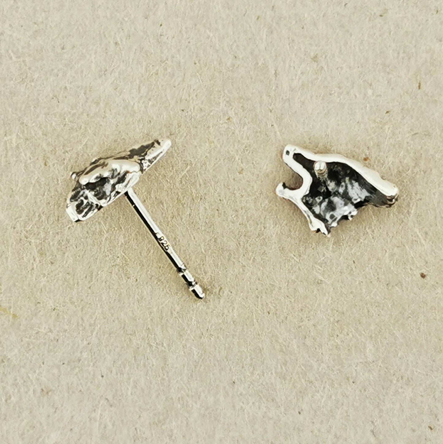 Howling wolf sterling silver earrings by Le Dragon Argenté, capturing wild spirit and natural strength in detailed handcrafted studs.
