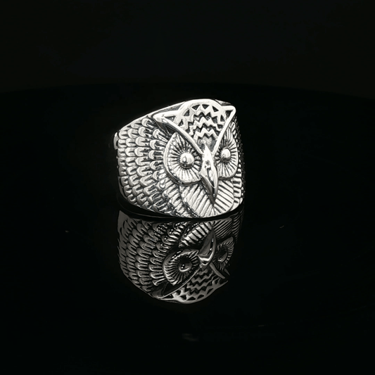 Large owl signet ring in sterling silver with detailed owl face design by Le Dragon Argenté.