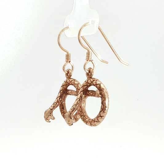 Antique bronze rattlesnake charm earrings, western gothic snake jewelry, small coiled serpent dangle earrings, desert inspired animal jewelry, edgy minimalist reptile earrings for everyday wear by Le Dragon Argenté