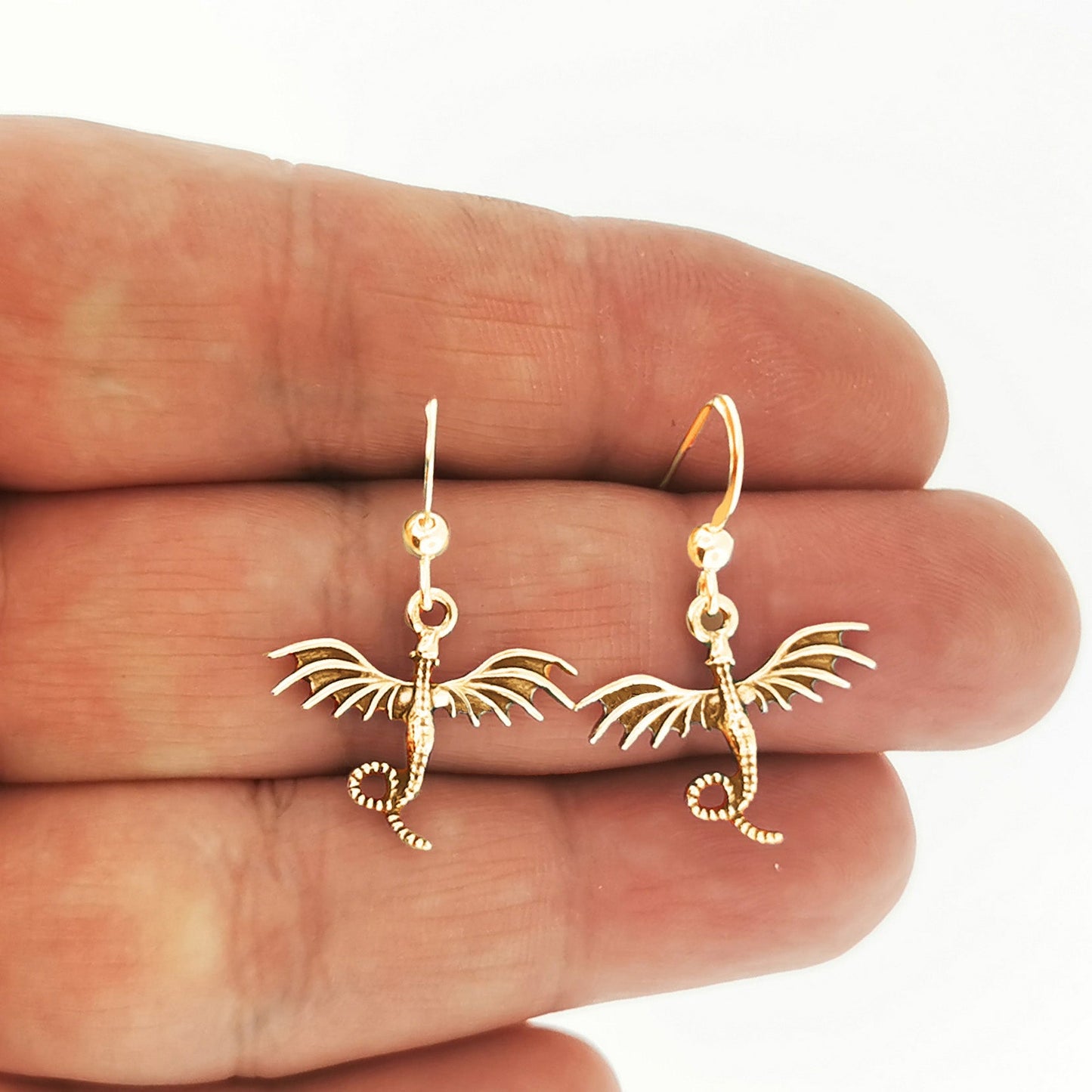 flying dragon charm earrings in gold made to order, flying dragon gold earrings, gold dragon earrings, gold dragon jewelry, gold dragon jewellery, flying dragon earrings, small dragon earrings, small gold dragon earrings, golden dragon earrings, small dragon dangle earrings, gold dangle earrings