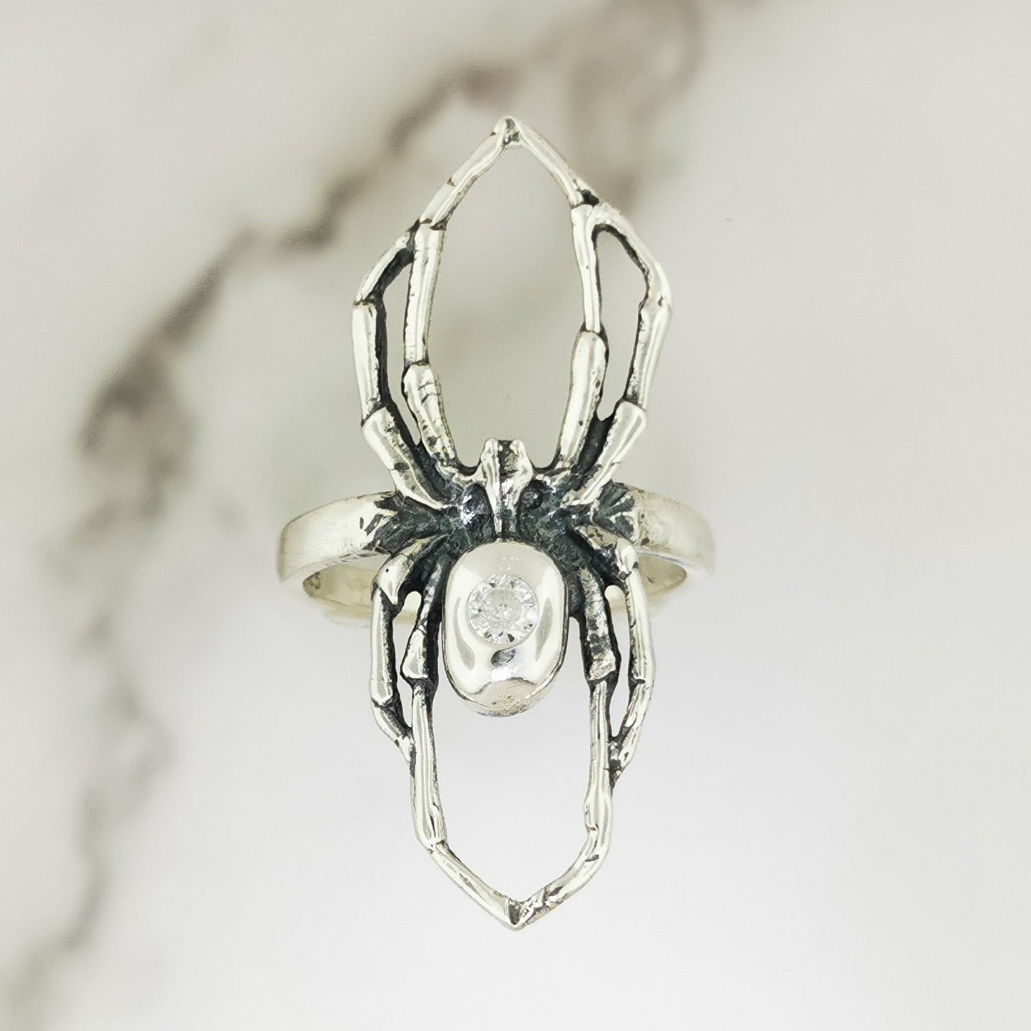 Handcrafted sterling silver spider ring with April birthstone CZ gothic 3D design perfect for fans of gothic fashion Halloween or witchy jewelry.- Le Dragon Argenté