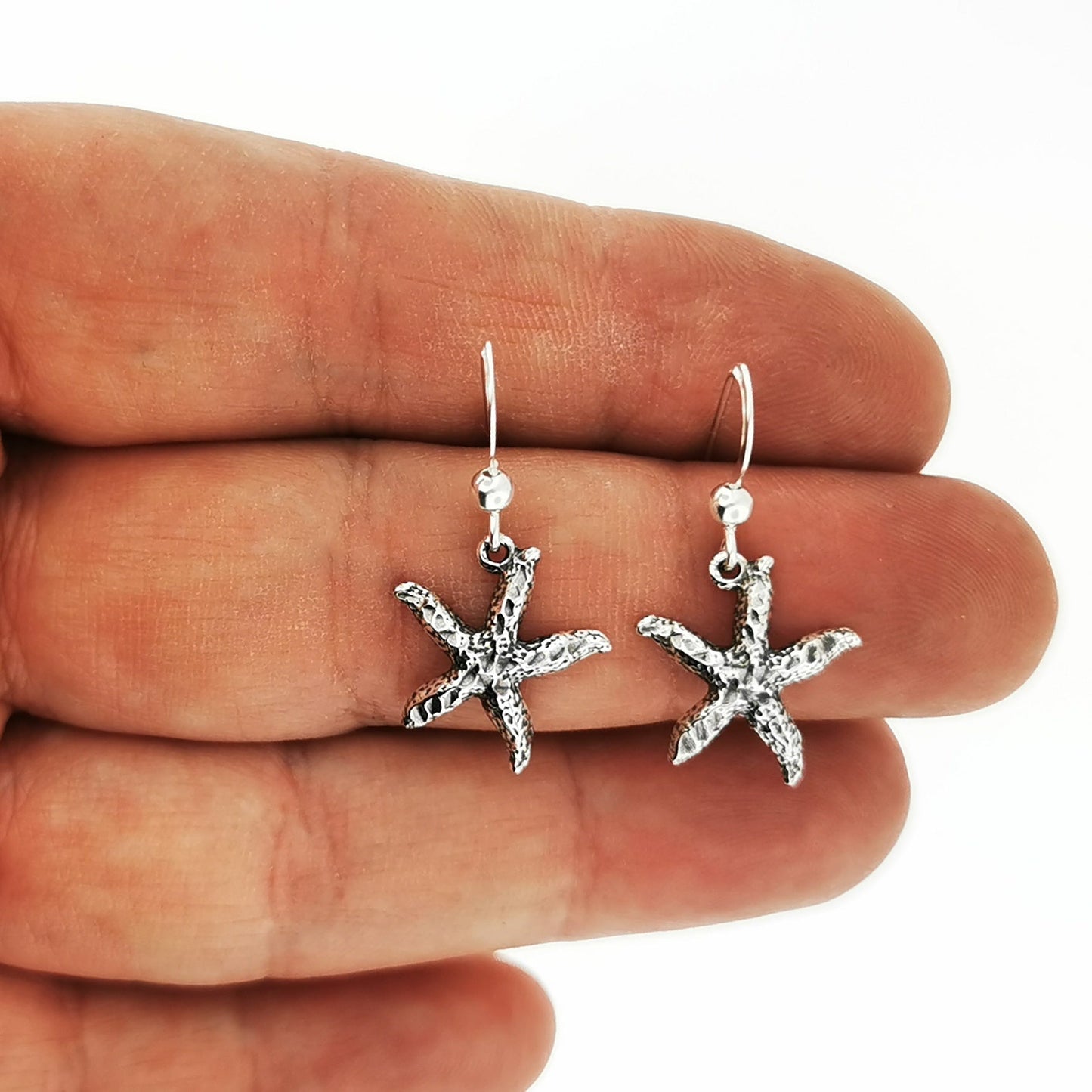 Starfish charm earrings in sterling silver perfect for beach lovers