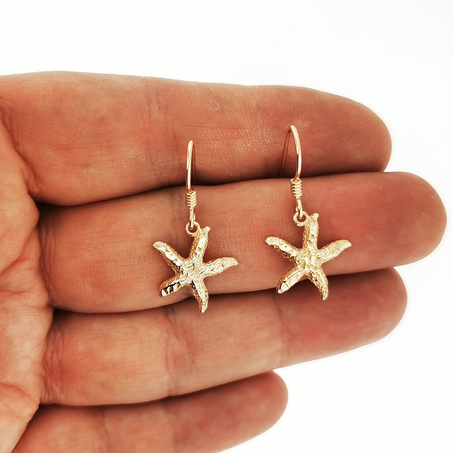 Bronze starfish dangle earrings handmade for coastal style outfits