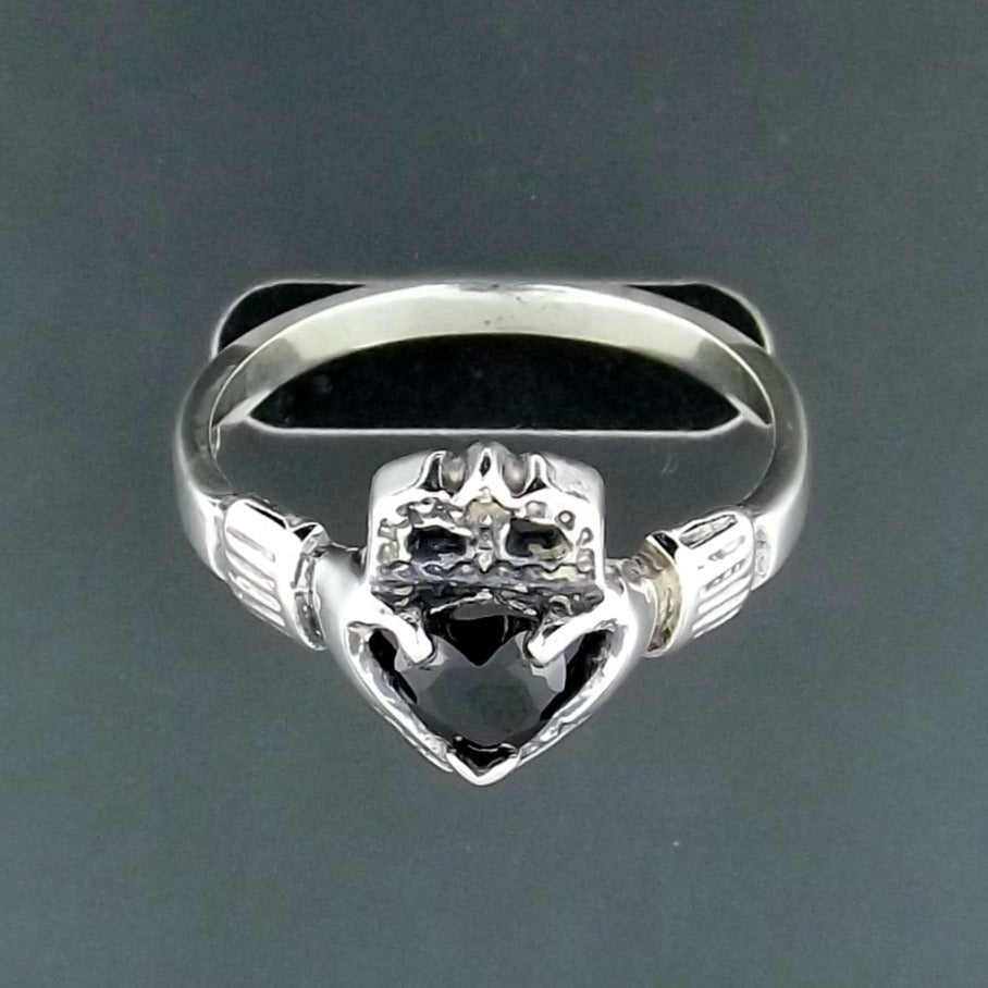 Sterling silver Claddagh ring with a heart-shaped imitation birthstone. Features the classic Irish Celtic hands, heart, and crown design, symbolizing love, loyalty, and friendship. Perfect for women, gifts, or everyday Celtic-inspired jewelry.