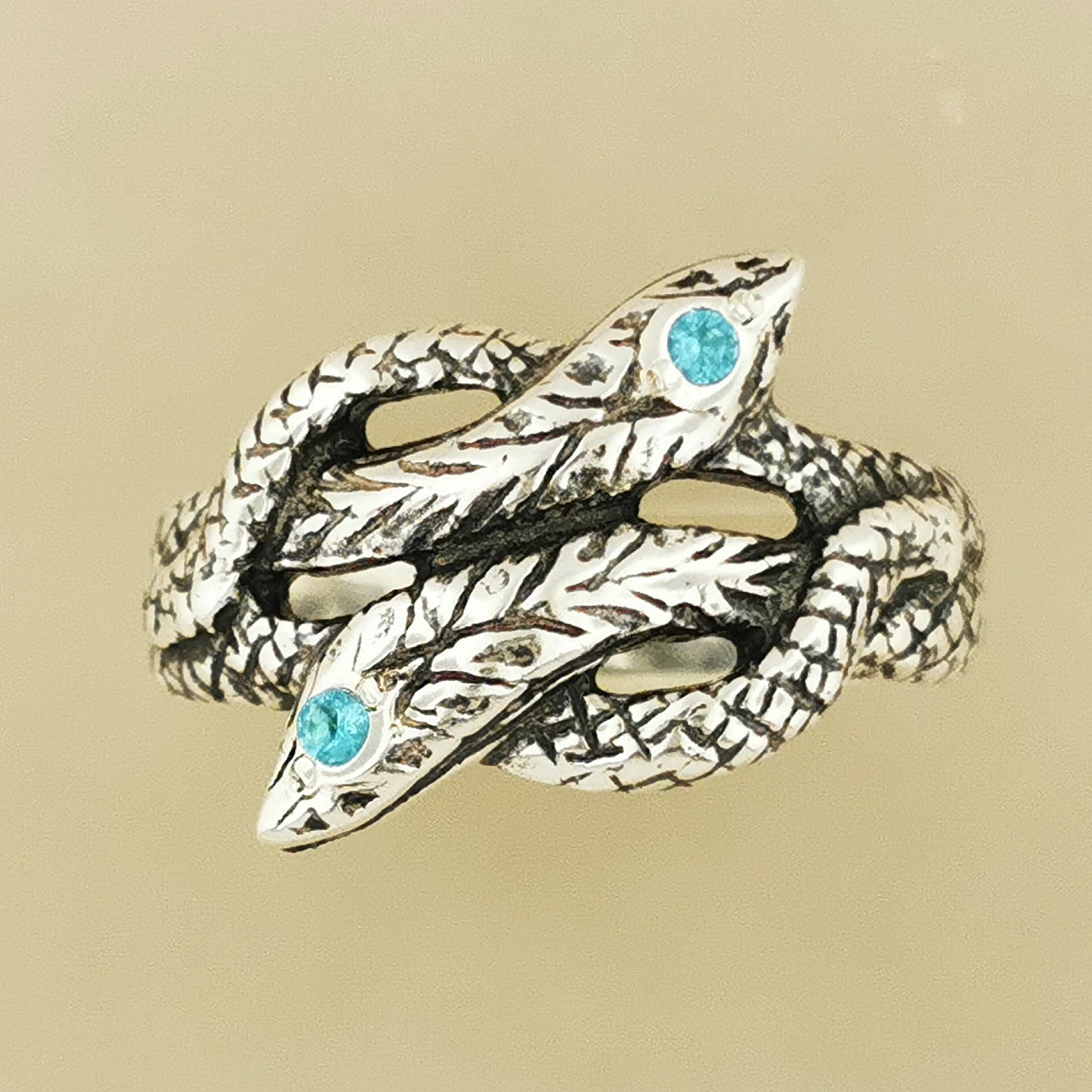 Twin Coiled Snakes Ring with December Birthstone in Sterling Silver - Le Dragon Argenté