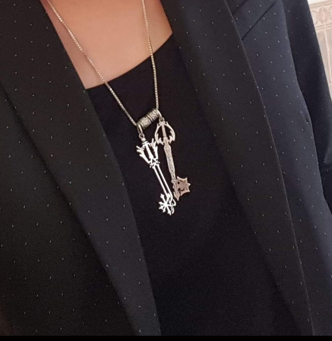 Oblivion & Oathkeeper keyblade pendants in silver worn on a chain