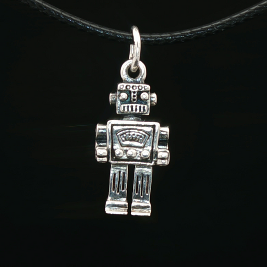 Silver robot pendant on a black cord against a black background