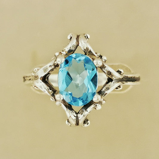 1950s scroll work style ring in sterling silver with blue topaz, silver gemstone ring, retro silver ring, mid century silver ring, mid century gemstone ring, retro gemstone ring, silver engagement ring, gemstone engagement ring, sterling silver gemstone ring, silver gemstone wedding ring, sterling silver wedding ring, retro wedding ring, silver retro wedding ring, gemstone promise ring, vintage gemstone ring, vintage silver ring, vintage sterling silver gemstone ring, silver scrollwork ring