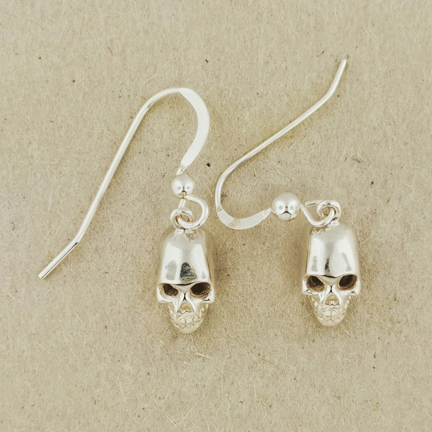 3D Skull earrings in sterling silver, silver skull earrings, sterling silver skull earrings, small skull earrings, small silver skull earrings, silver skull jewelry, silver skull jewellery, silver goth earrings, silver gothic earrings, silver witchy earrings, silver spooky earrings, spooky silver jewelry, spooky silver jewellery, human skull earrings, silver human skull earrings, sterling silver human skull earrings