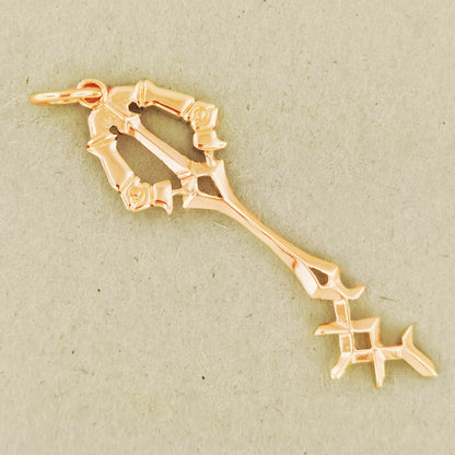 Kingdom Hearts Rainfell Keyblade Pendant in Pink Gold, Gold Key Pendant, Gold Keyblade Pendant, KH Keyblade Pendant, Gold KH Pendant, Gold Kingdom Hearts Keyblade, Gold Kingdom Hearts Keyblade Pendant, Kingdom Hearts Jewelry, Kindom Hearts Jewellery, Gamer Geek Jewelry, Gamer Geek Jewellery, Gold Gamer Pendant, Gold Rainfell Keyblade Pendant, Video Game Jewelry, Video Game Pendant