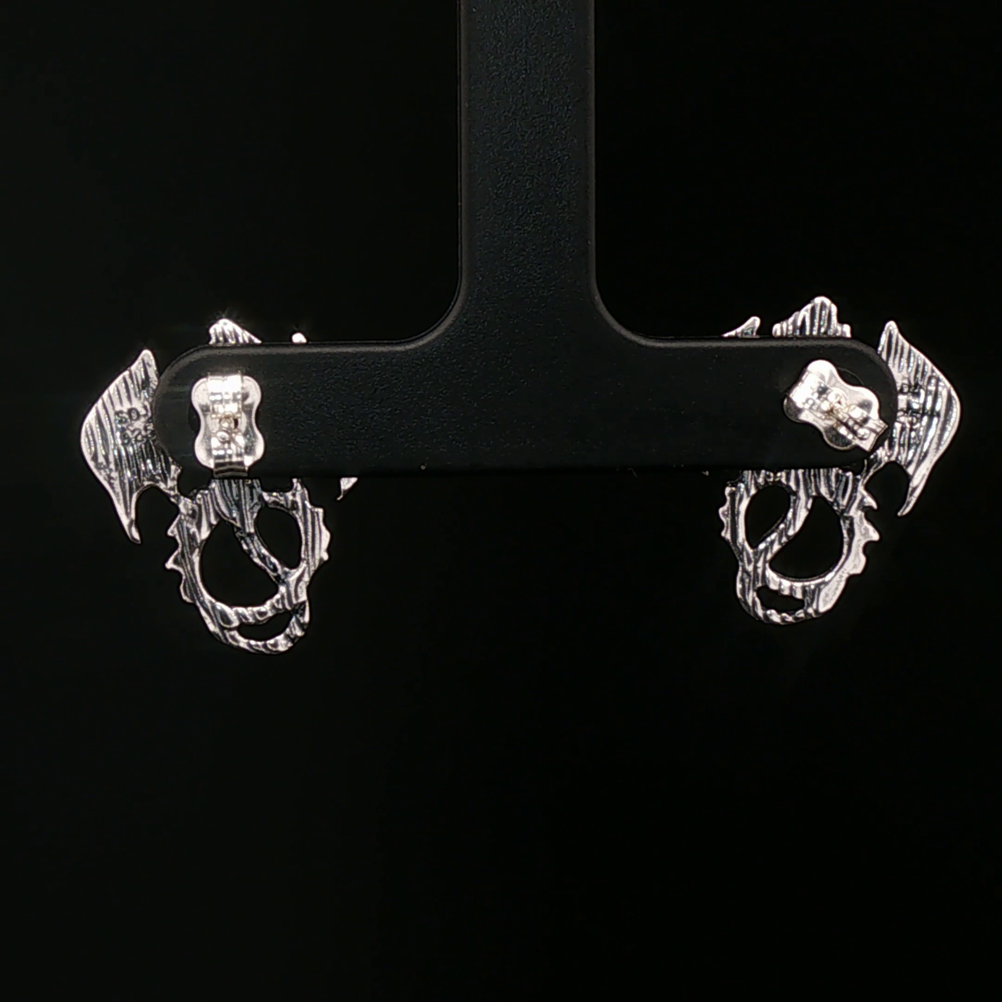 Winged dragon stud earrings in solid sterling silver from Le Dragon Argenté – dragon jewellery for fantasy fans and bold style lovers.