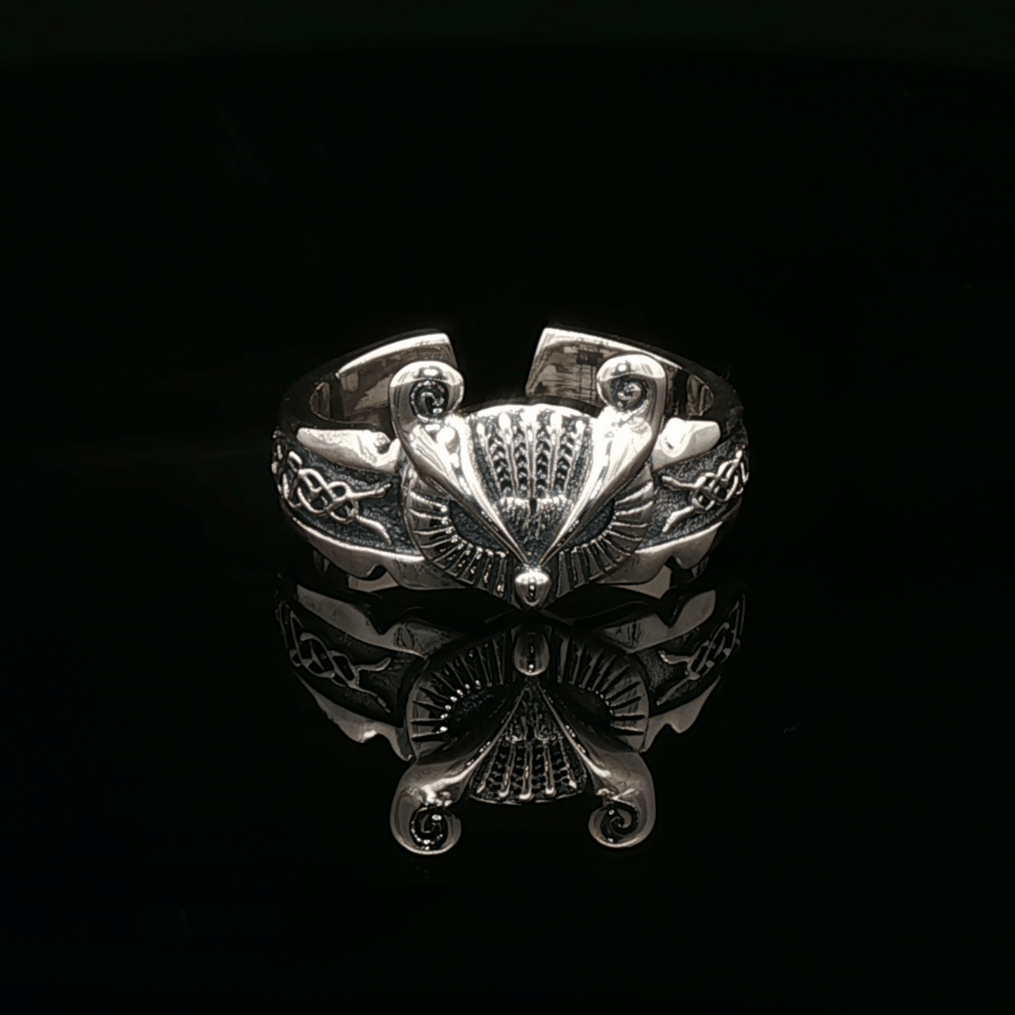 Adjustable Celtic owl ring in sterling silver with detailed knotwork and owl design by Le Dragon Argenté.