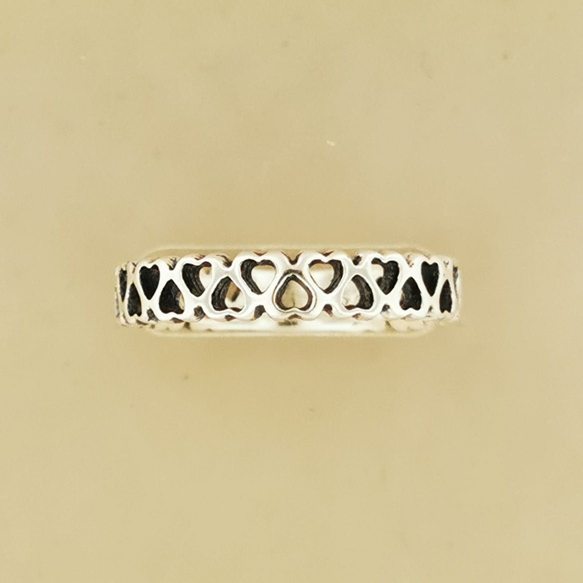 Connected Hearts Band Ring in sterling silver with linked heart design by Le Dragon Argenté