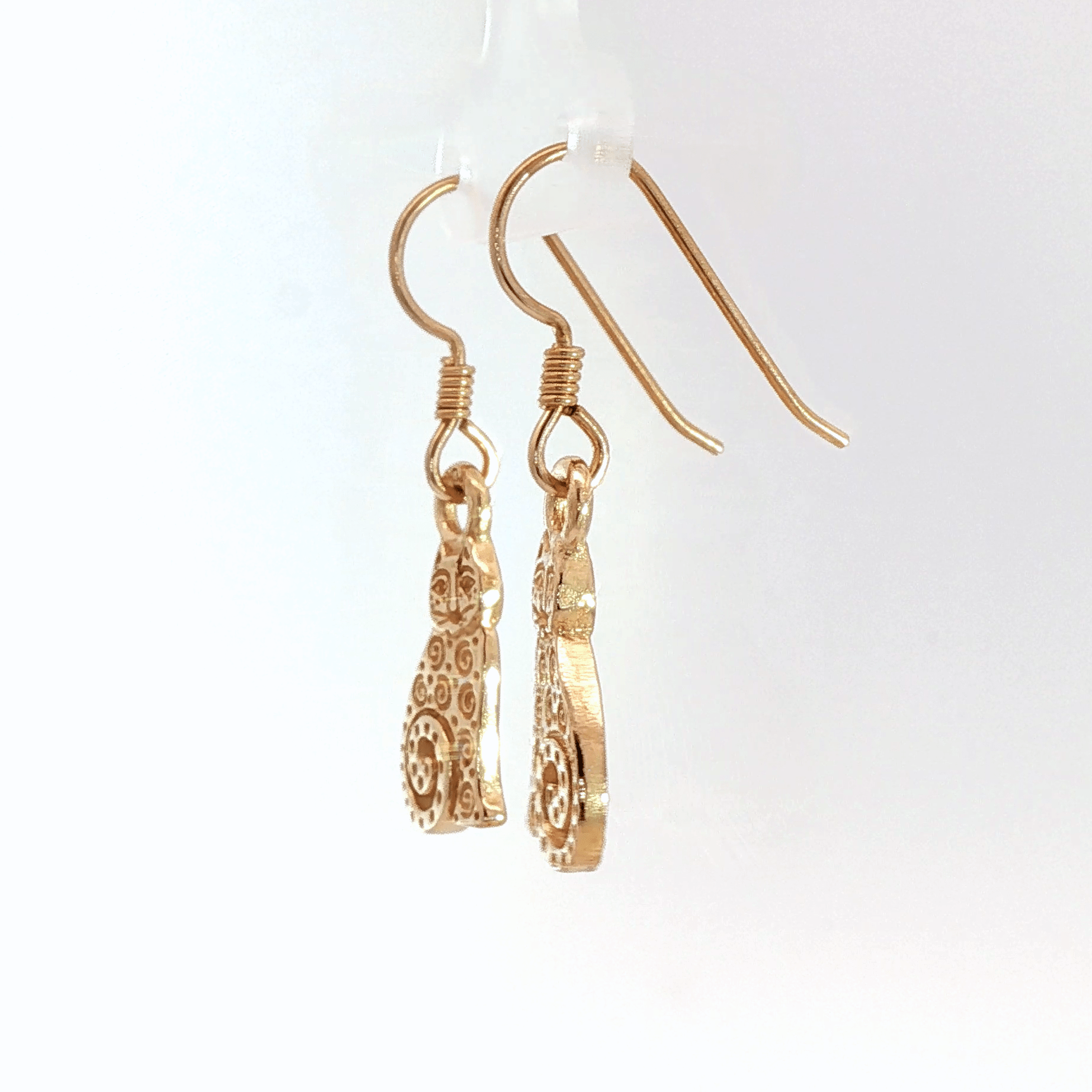 Country style cat charm earrings in antique bronze, rustic feline jewelry, small sitting cat dangle earrings, cottagecore farm aesthetic earrings, minimalist animal lover jewelry for everyday wear by Le Dragon Argenté