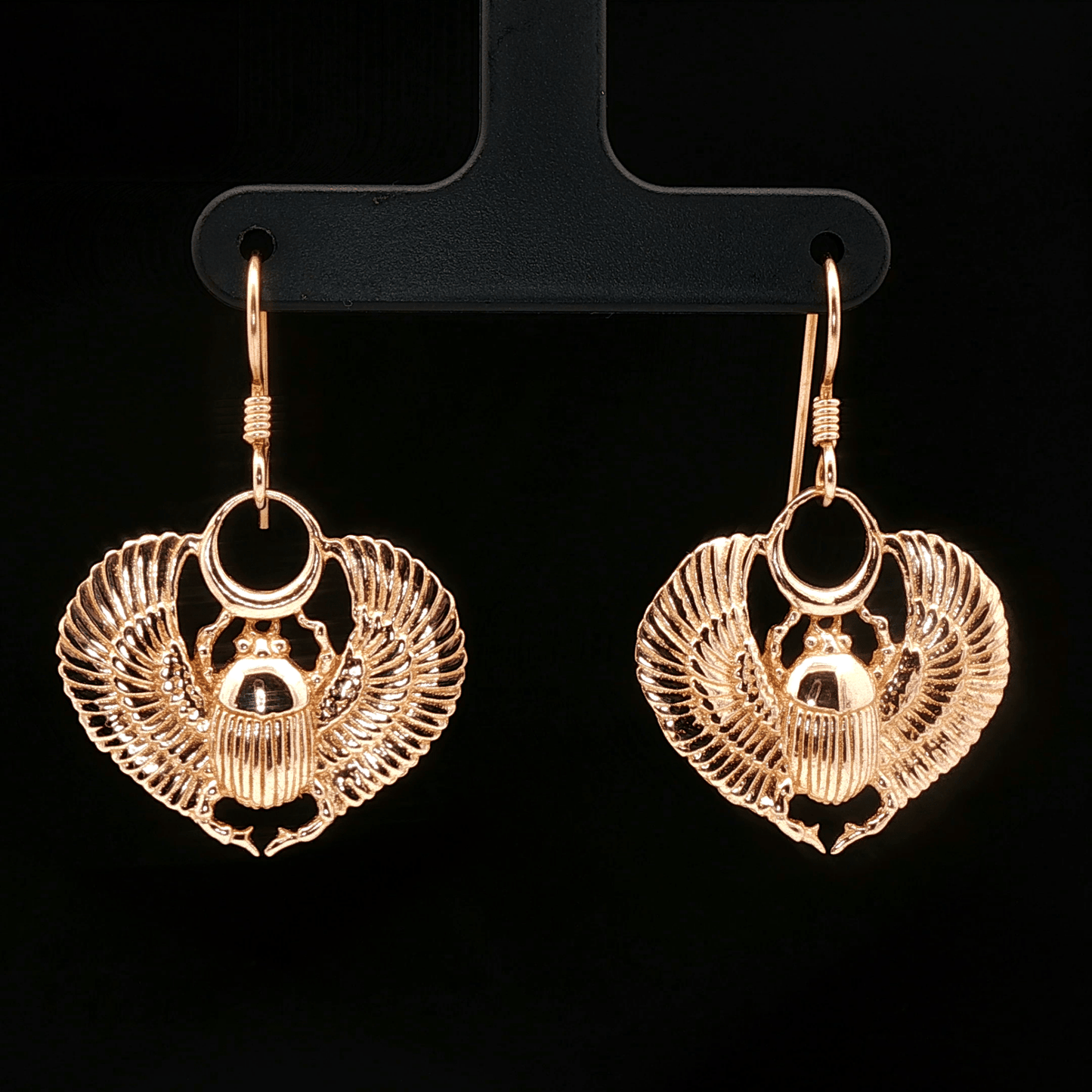 Handmade Winged scarab beetle earrings inspired by ancient Egyptian jewellery, available in sterling silver, antique bronze, or stainless steel. These symbolic scarab talisman earrings represent protection, rebirth, and transformation. A meaningful accessory for mythology lovers, museum enthusiasts, and those who enjoy unique handcrafted historical-style jewellery.