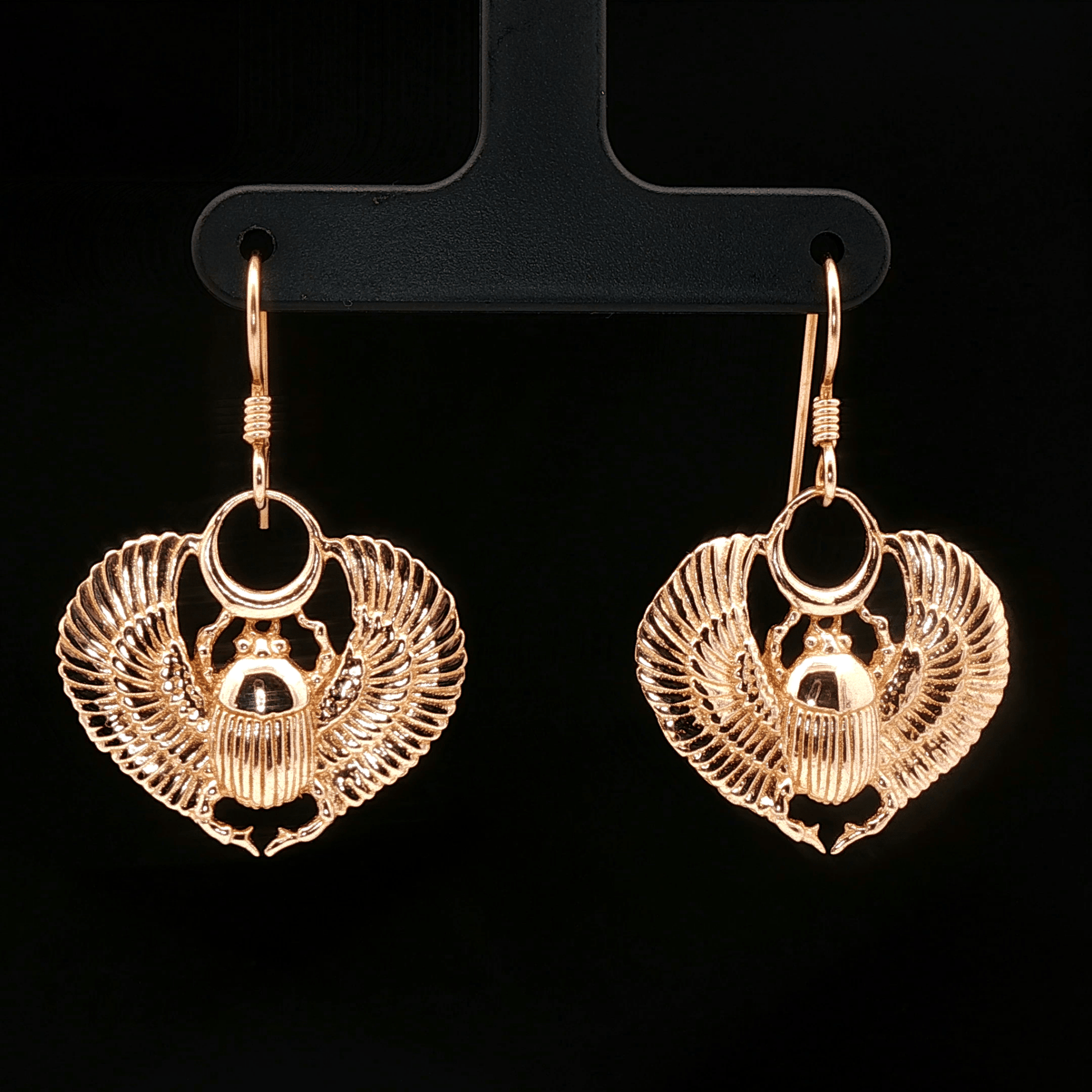 Handmade Winged scarab beetle earrings inspired by ancient Egyptian jewellery, available in sterling silver, antique bronze, or stainless steel. These symbolic scarab talisman earrings represent protection, rebirth, and transformation. A meaningful accessory for mythology lovers, museum enthusiasts, and those who enjoy unique handcrafted historical-style jewellery.