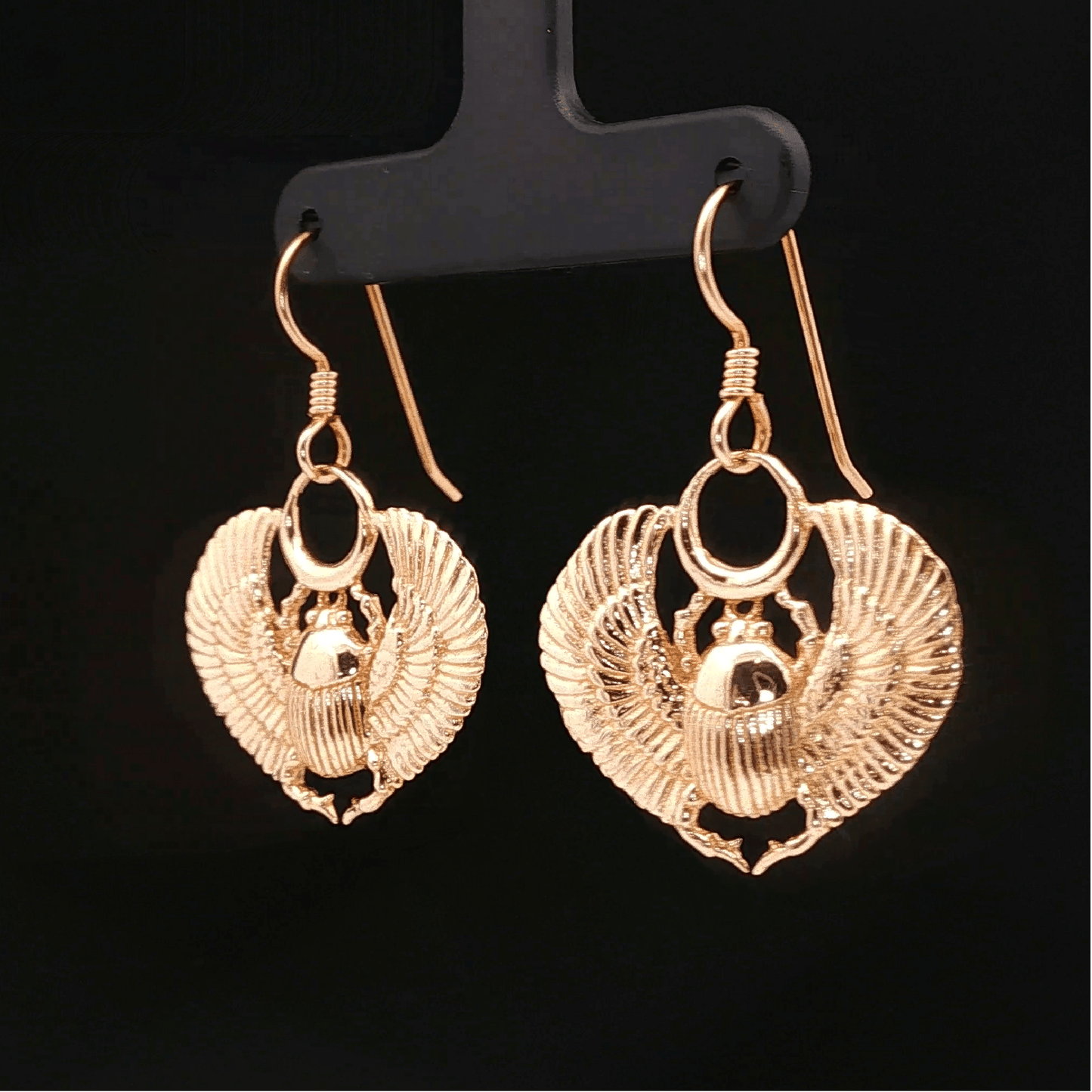 Handmade Winged scarab beetle earrings inspired by ancient Egyptian jewellery, available in sterling silver, antique bronze, or stainless steel. These symbolic scarab talisman earrings represent protection, rebirth, and transformation. A meaningful accessory for mythology lovers, museum enthusiasts, and those who enjoy unique handcrafted historical-style jewellery.