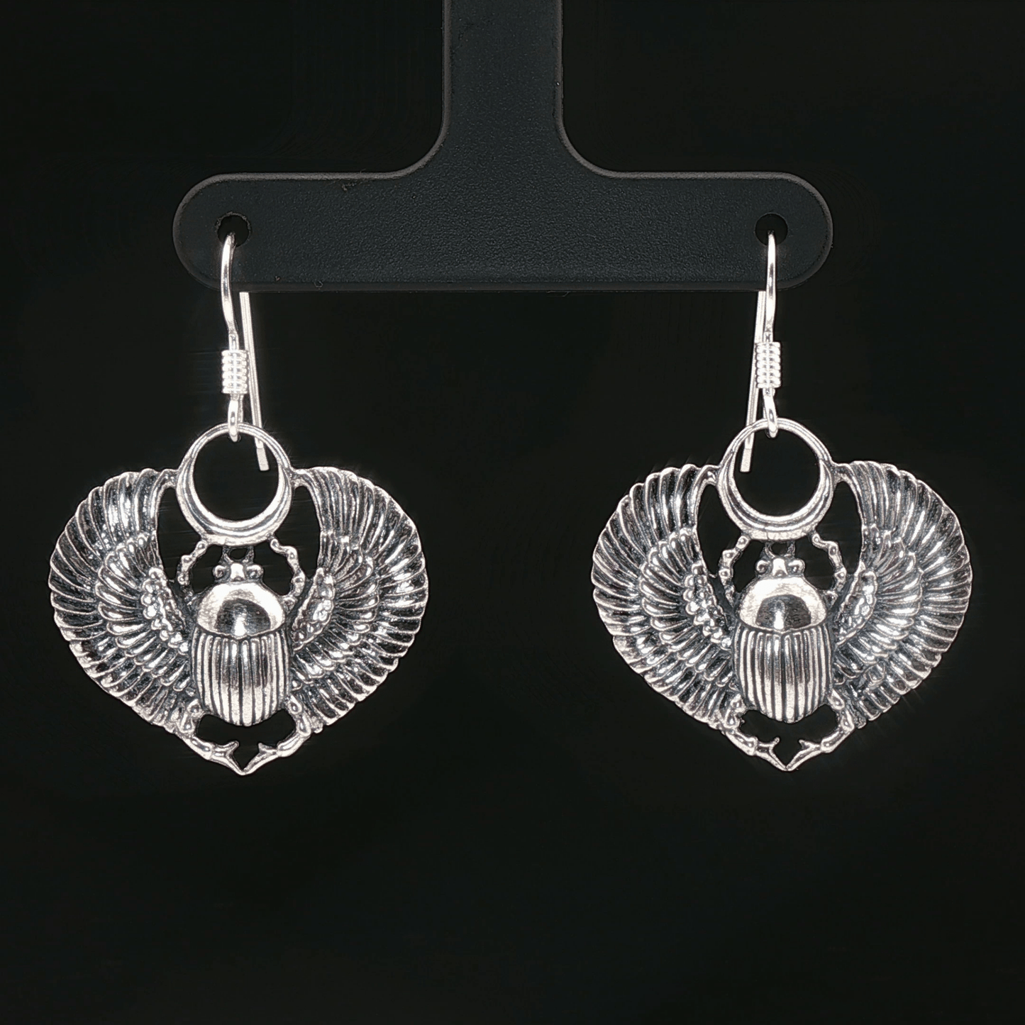 Handmade Winged scarab beetle earrings inspired by ancient Egyptian jewellery, available in sterling silver, antique bronze, or stainless steel. These symbolic scarab talisman earrings represent protection, rebirth, and transformation. A meaningful accessory for mythology lovers, museum enthusiasts, and those who enjoy unique handcrafted historical-style jewellery.