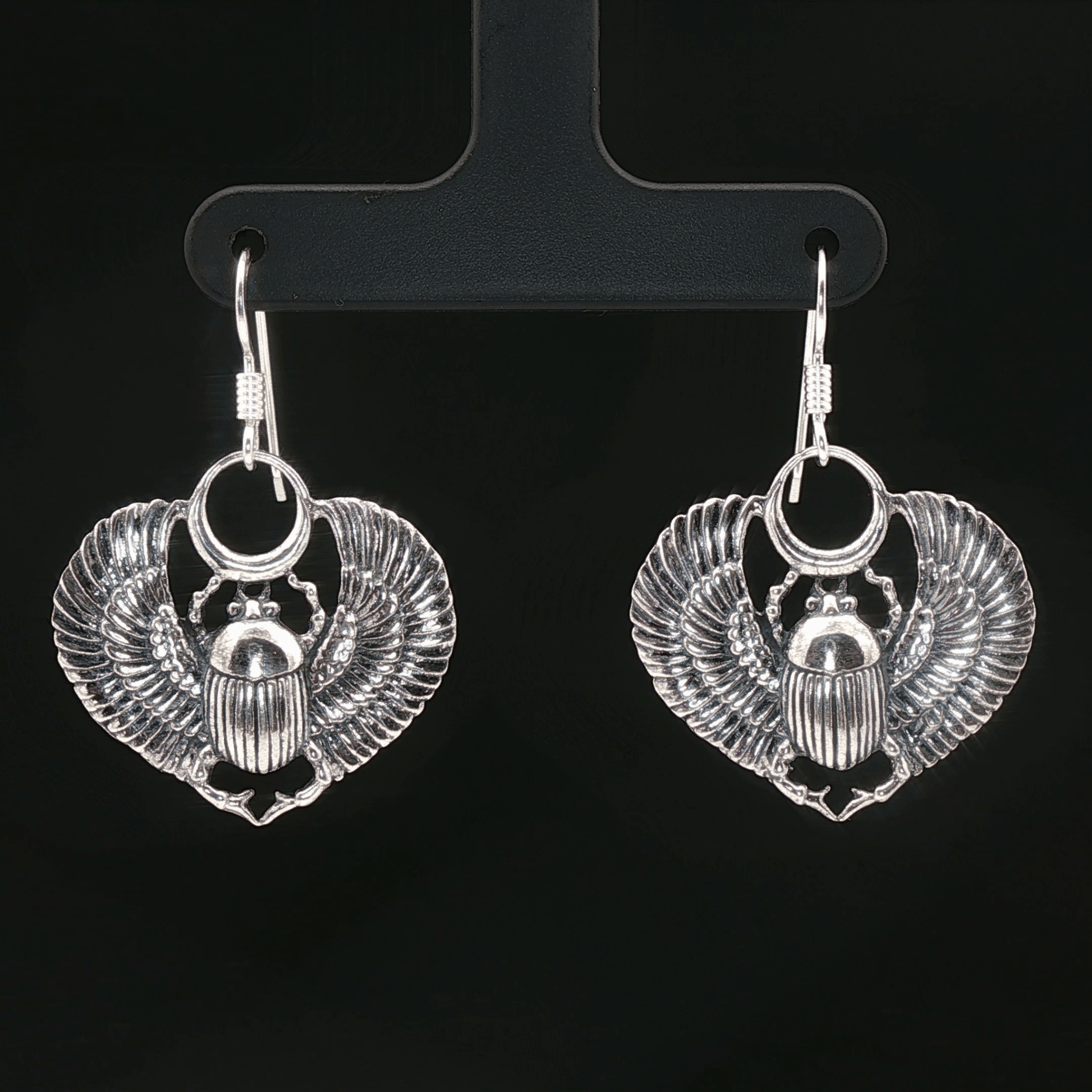 Handmade Winged scarab beetle earrings inspired by ancient Egyptian jewellery, available in sterling silver, antique bronze, or stainless steel. These symbolic scarab talisman earrings represent protection, rebirth, and transformation. A meaningful accessory for mythology lovers, museum enthusiasts, and those who enjoy unique handcrafted historical-style jewellery.