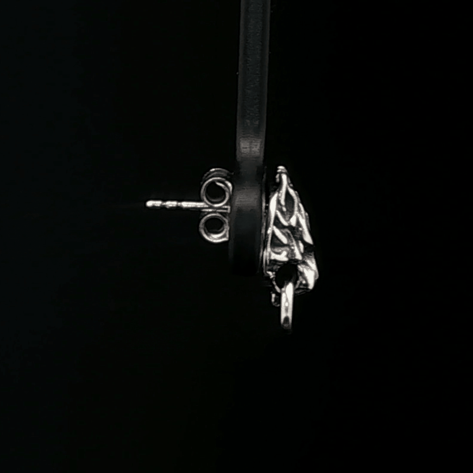 Handcrafted FF7 Fenrir stud earrings in sterling silver, inspired by Final Fantasy VII, featuring intricate wolf design for retro gamer fans and jewellery lovers alike.