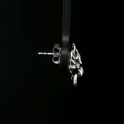 Handcrafted FF7 Fenrir stud earrings in sterling silver, inspired by Final Fantasy VII, featuring intricate wolf design for retro gamer fans and jewellery lovers alike.