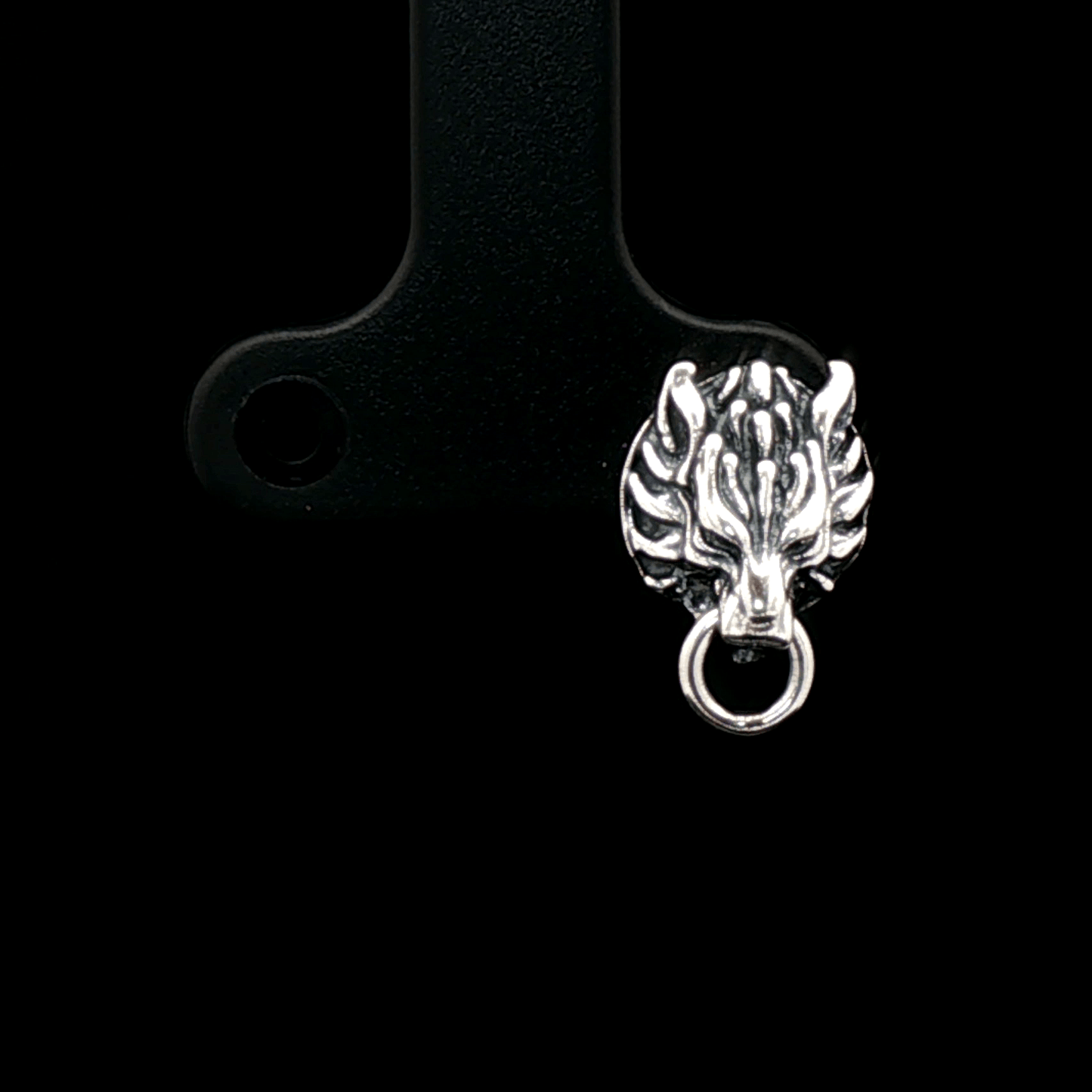 Handcrafted FF7 Fenrir stud earrings in sterling silver, inspired by Final Fantasy VII, featuring intricate wolf design for retro gamer fans and jewellery lovers alike.