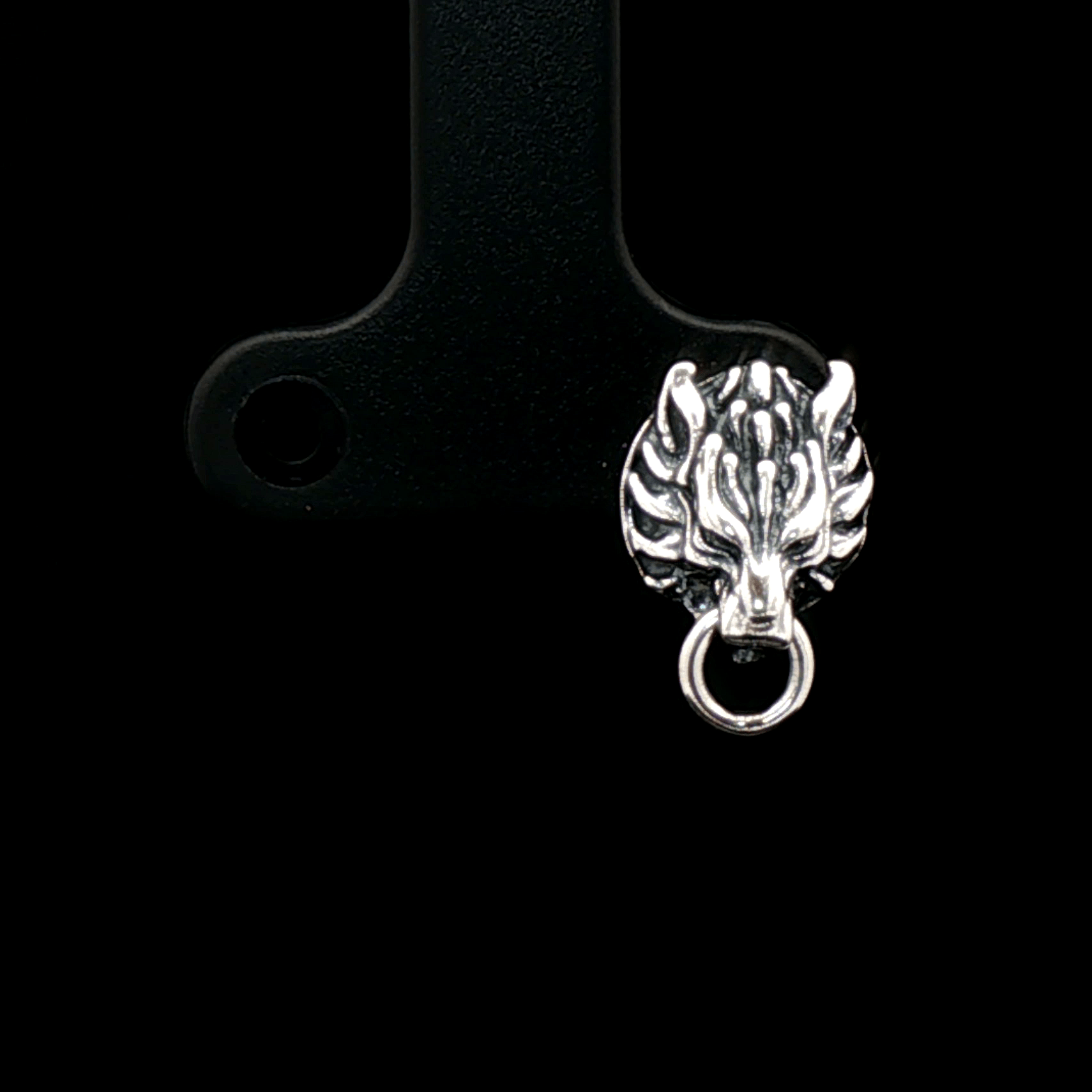 Handcrafted FF7 Fenrir stud earrings in sterling silver, inspired by Final Fantasy VII, featuring intricate wolf design for retro gamer fans and jewellery lovers alike.
