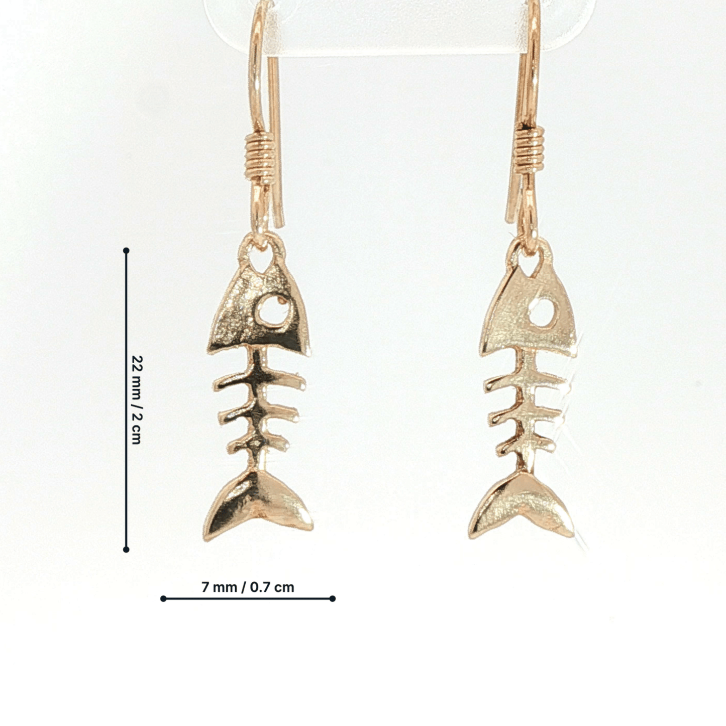 Fishbone charm earrings in antique bronze, quirky ocean jewelry, small fish skeleton dangle earrings, nautical themed animal jewelry, minimalist beach inspired earrings with playful aesthetic by Le Dragon Argenté