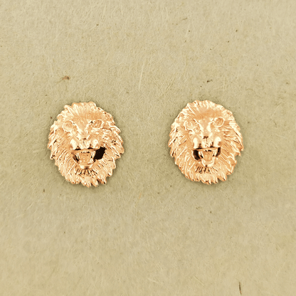 Made-to-order lion head studs by Le Dragon Argenté in solid gold, available in white, pink, or yellow gold and 10k, 14k, or 18k options.