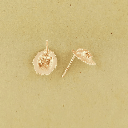 Made-to-order lion head studs by Le Dragon Argenté in solid gold, available in white, pink, or yellow gold and 10k, 14k, or 18k options.