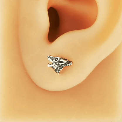 Howling wolf sterling silver earrings by Le Dragon Argenté, capturing wild spirit and natural strength in detailed handcrafted studs.