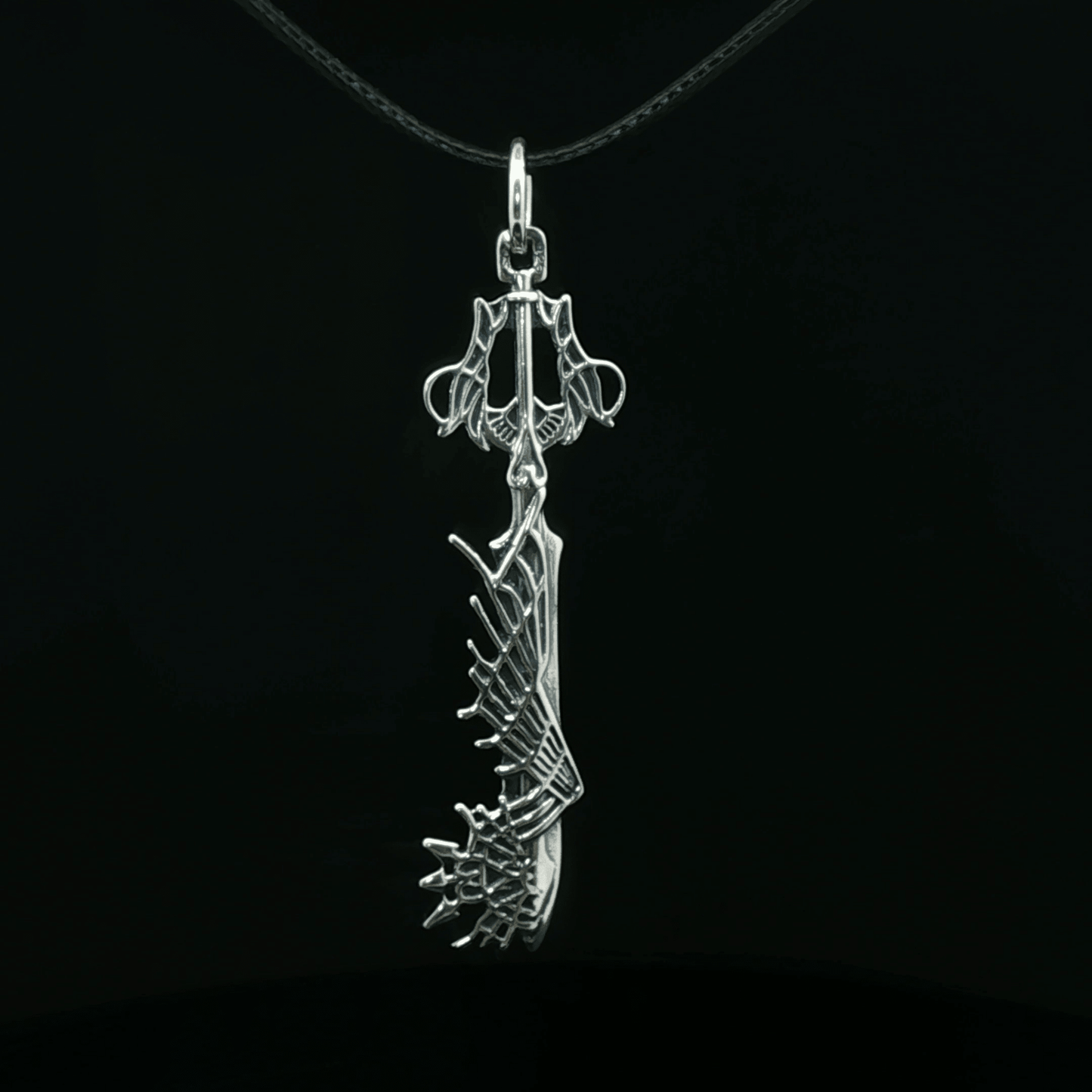 Stainless steel Ultima Keyblade pendant inspired by Kingdom Hearts, detailed gamer necklace with iconic fantasy weapon design by Le Dragon Argenté