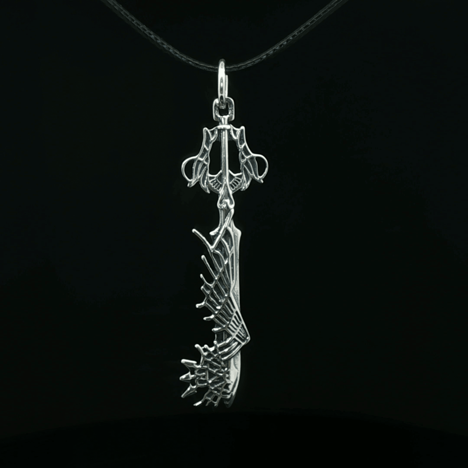 Stainless steel Ultima Keyblade pendant inspired by Kingdom Hearts, detailed gamer necklace with iconic fantasy weapon design by Le Dragon Argenté