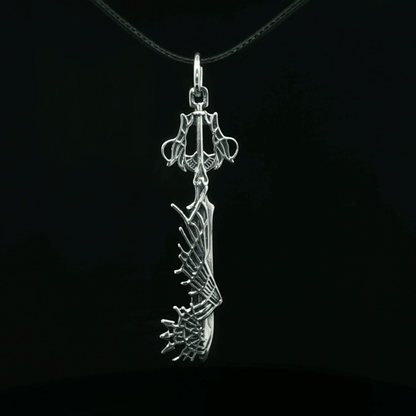 Stainless steel Ultima Keyblade pendant inspired by Kingdom Hearts, detailed gamer necklace with iconic fantasy weapon design by Le Dragon Argenté