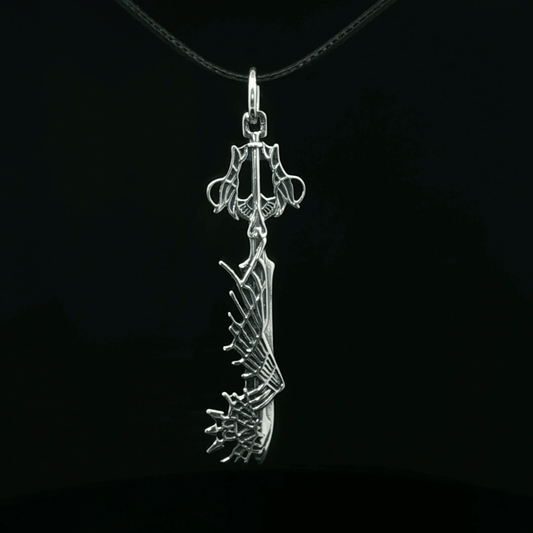Stainless steel Ultima Keyblade pendant inspired by Kingdom Hearts, detailed gamer necklace with iconic fantasy weapon design by Le Dragon Argenté