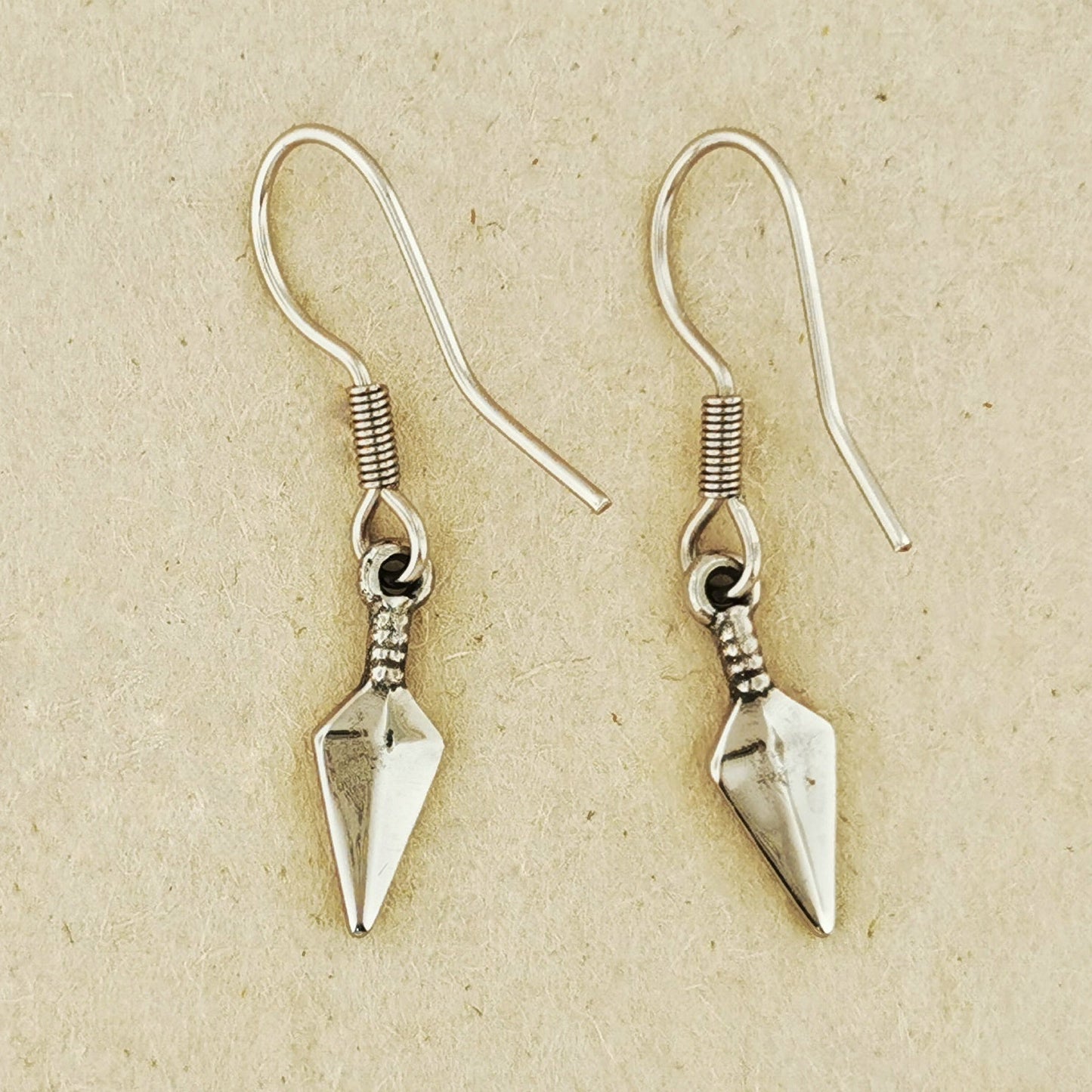 Kunai charm earrings handmade geek chic accessory. Handcrafted anime kunai earrings subtle fandom jewelry. Stainless steel kunai charm earrings geek fandom jewelry. 