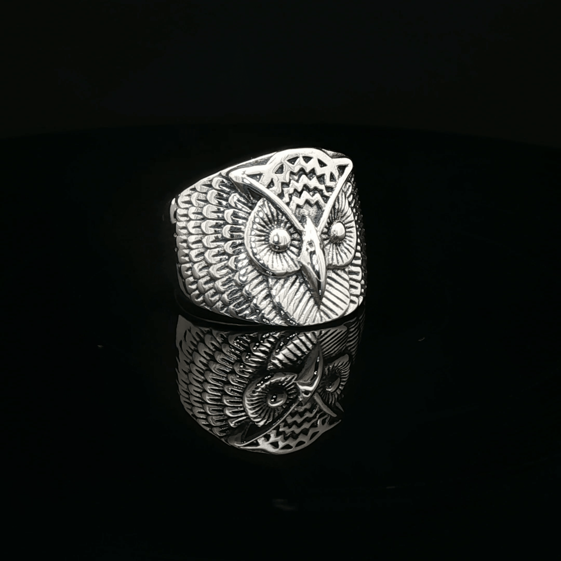 Large owl signet ring in sterling silver with detailed owl face design by Le Dragon Argenté.