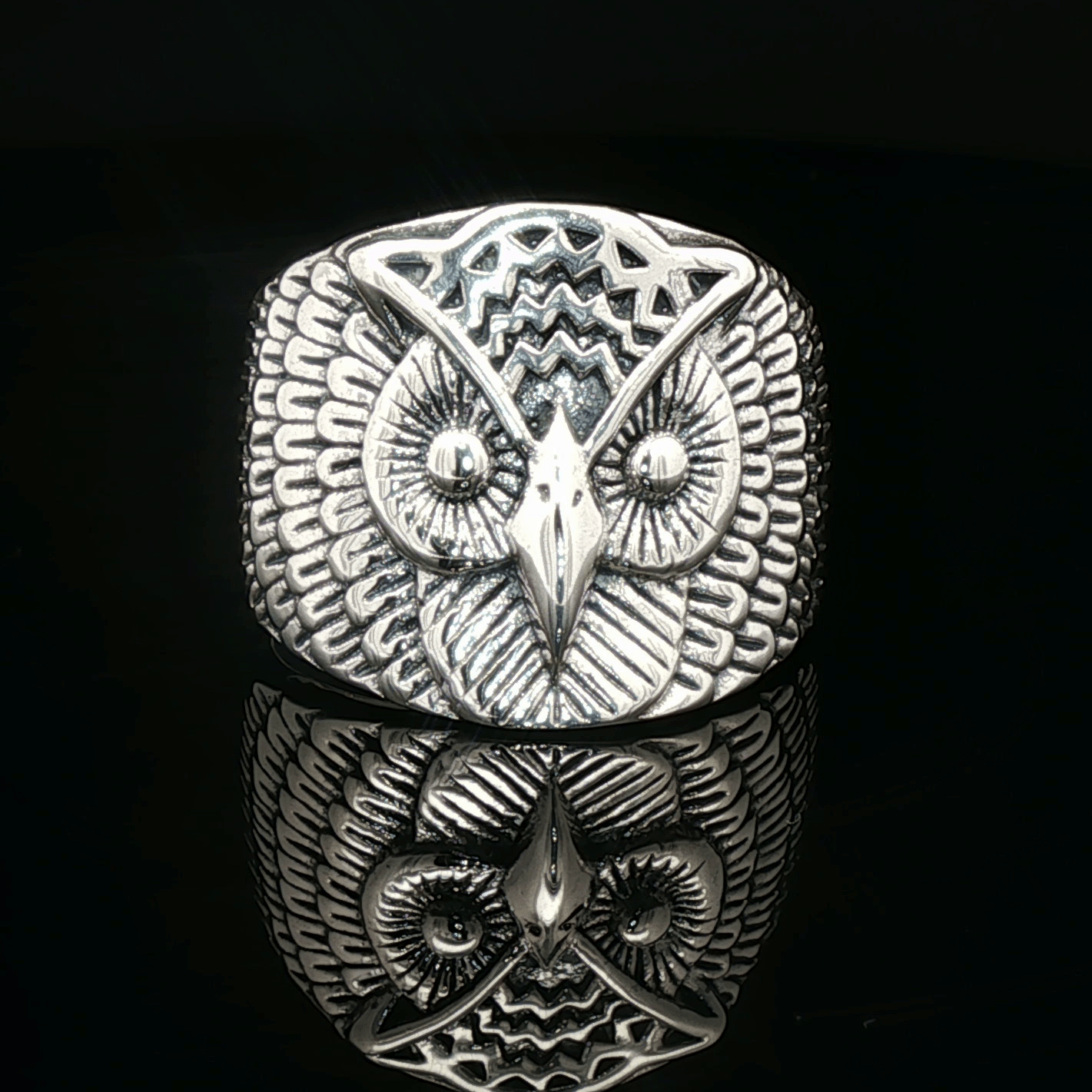 Large owl signet ring in sterling silver with detailed owl face design by Le Dragon Argenté.