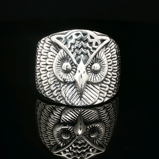 Large owl signet ring in sterling silver with detailed owl face design by Le Dragon Argenté.
