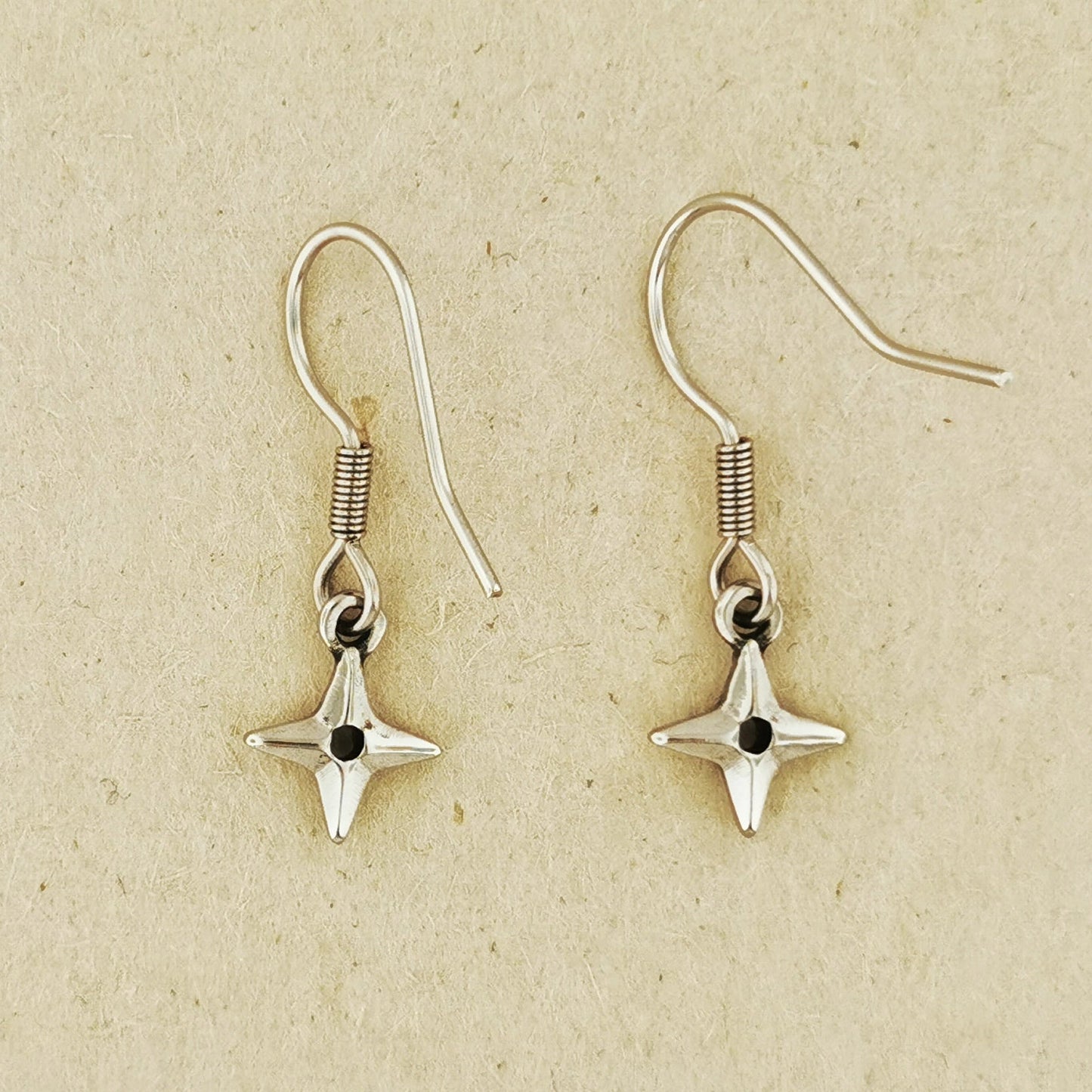 Ninja Shuriken Throwing Star charm earrings inspired by Japanese ninja weapons and anime cosplay. Available in .925 sterling silver, antique bronze, and stainless steel options. Handcrafted dangle earrings for gamers, anime lovers, and geeks who love unique Japanese-inspired accessories. Stylish gift for cosplay or everyday wear.
