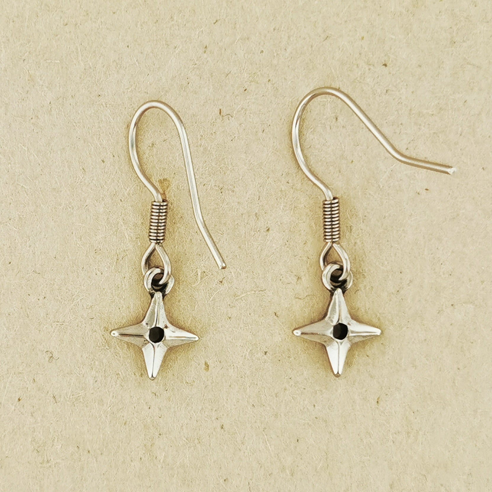 Ninja Shuriken Throwing Star charm earrings inspired by Japanese ninja weapons and anime cosplay. Available in .925 sterling silver, antique bronze, and stainless steel options. Handcrafted dangle earrings for gamers, anime lovers, and geeks who love unique Japanese-inspired accessories. Stylish gift for cosplay or everyday wear.